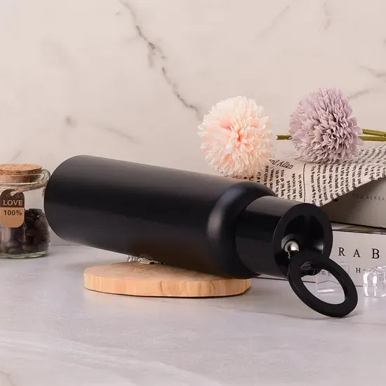Black vacuum insulated water bottle with magnetic phone holder